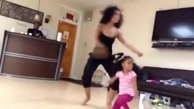 Little Girl Dancing Like Her Mother